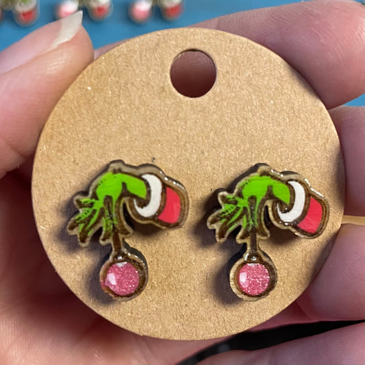 Grinch hand with ornament stud earrings